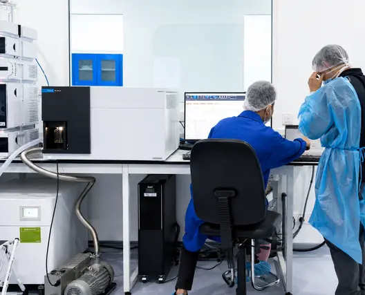MyGenome laboratory team reviewing genetic screening equipment